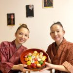 Owner twin sisters with sushi